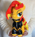 Load image into Gallery viewer, Plush toy with yellow and red design held by a person against a white background