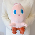 Load image into Gallery viewer, Plush toy with a cute design held by a person wearing a white sweater.
