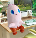 Load image into Gallery viewer, Plush toy with blue eyes on a desk in front of a computer screen