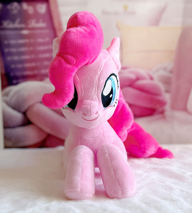 Load image into Gallery viewer, Pink plush toy with a white border on a soft surface
