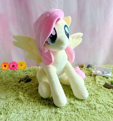 Load image into Gallery viewer, My Little Pony - Fluttershy Jumbo Plush — a 20-inch jumbo officially licensed plush of Fluttershy — available at Symbiote Studios.
