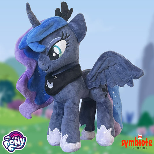 Plush toy of a pony with blue hair and wings, featuring My Little Pony and Symbiote Studios logos.