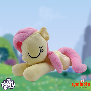 Load image into Gallery viewer, My Little Pony Fluttershy Dream Plush, a sleepy-eyed officially licensed dream plush of Fluttershy, sold by Symbiote Studios. (SleepingFluttershy.jpg)