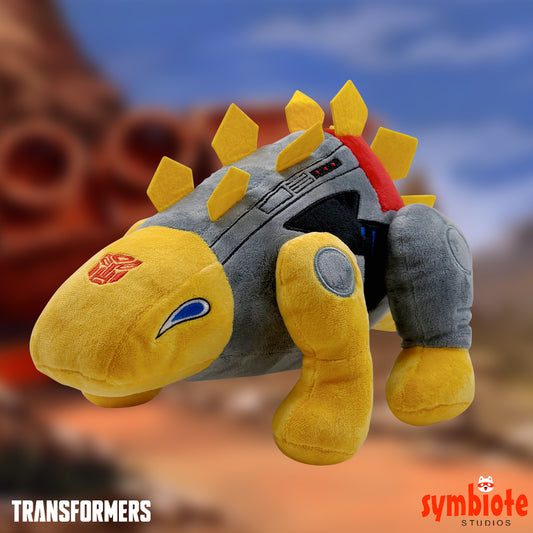 Plush toy resembling a character from 'Transformers' with a blurred background