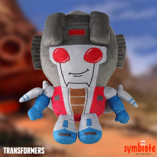 Plush toy resembling a robot character from Transformers with a blurred background