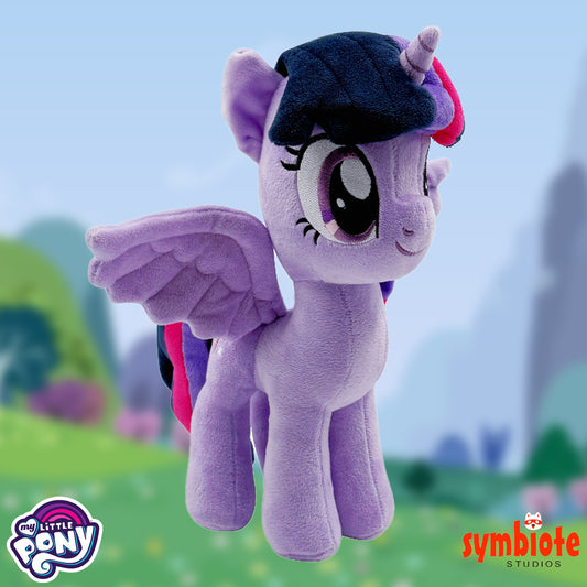 Plush toy of a purple pony with a black hat in a blurred outdoor setting, featuring 'My Little Pony' and 'Symbiote Studios' logos.