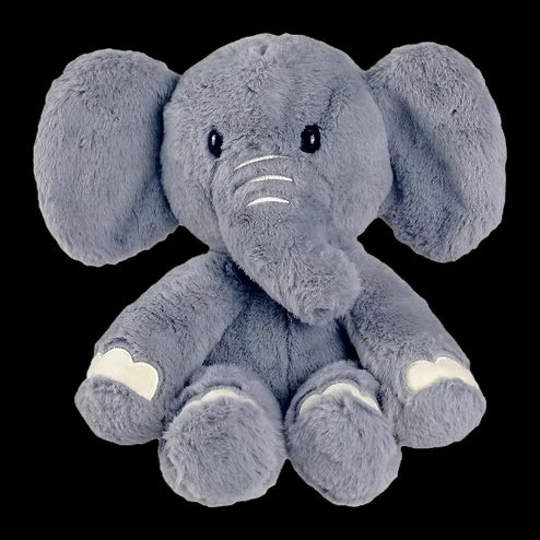 Plush elephant toy on a black background