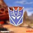 Load image into Gallery viewer, Transformers Decepticon Logo Pin, an officially licensed enamel pin of the Decepticon emblem, sold by Symbiote Studios.
