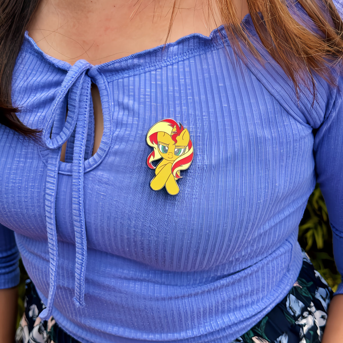 An officially licensed enamel pin of Sunset Shimmer from My Little Pony. Pictured here is the My Little Pony Sunset Shimmer Pin.