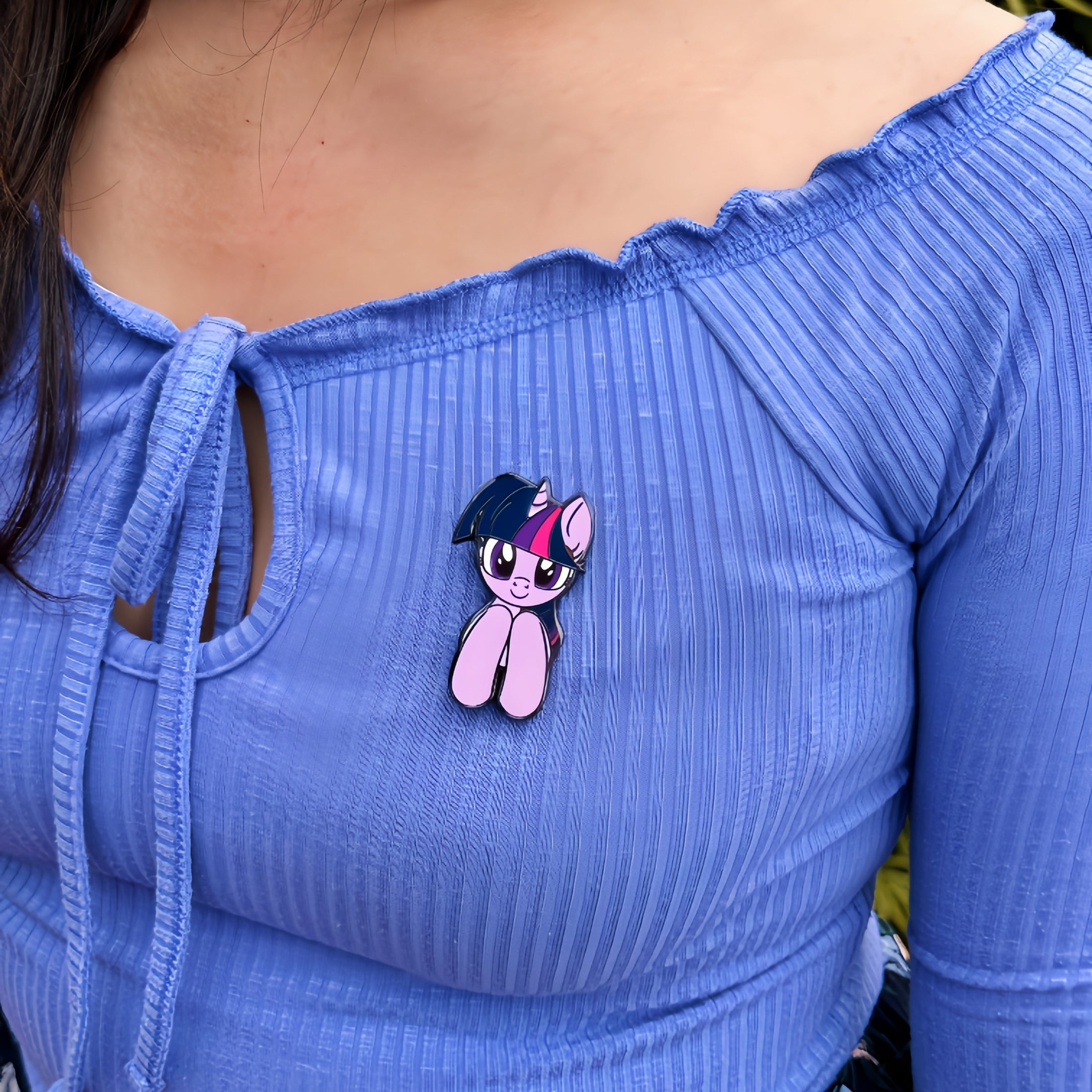 An officially licensed enamel pin of Twilight Sparkle from My Little Pony. Pictured here is the My Little Pony Twilight Sparkle Pin.