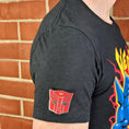 Load image into Gallery viewer, An officially licensed enamel pin of the Autobot emblem. Pictured here is the Transformers Autobot Logo Pin.
