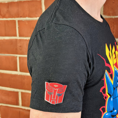 Load image into Gallery viewer, An officially licensed enamel pin of the Autobot emblem. Pictured here is the Transformers Autobot Logo Pin.
